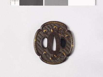Mokkō-shaped tsuba with plum flowersfront