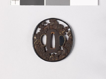 Tsuba with shishi, or lion dogs, among peonies and rocksfront