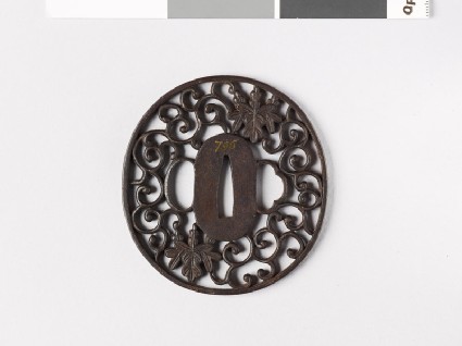 Tsuba with floral scrolls and gosan-no-kiri, or paulownia leavesfront