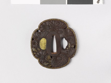 Mokkō-shaped tsuba with chrysanthemum flowers and leavesfront