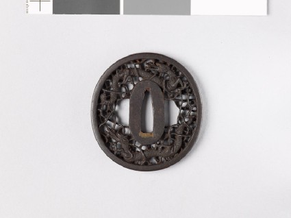 Tsuba with two dragons amid karakusa, or scrolling plant patternfront