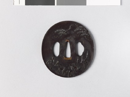 Tsuba with cranes standing beneath a pine treefront
