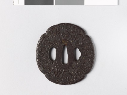 Mokkō-shaped tsuba with waves and spray dropsfront