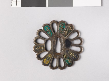 Tsuba in the form of a chrysanthemum monfront