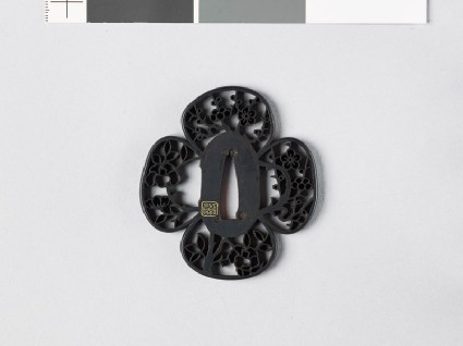 Mokkō-shaped tsuba with camellia bush and plum treefront