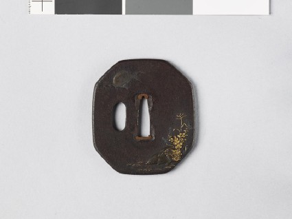 Octagonal tsuba depicting a wild boar sleeping in a landscapefront