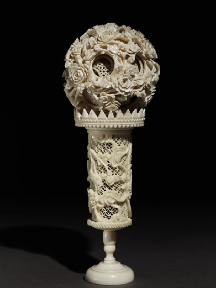 Ivory ball and stand with floral decorationside