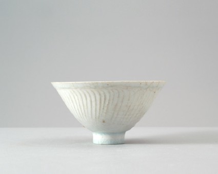 White ware bowl with three boys among foliagefront