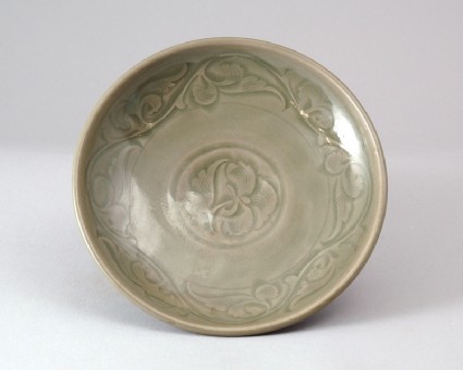Greenware dish with floral decorationfront