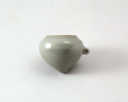 Greenware bird feeder in the form of a pointed fruitfront