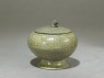 Globular greenware jar with lotus flower decoration (oblique)