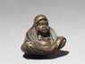 Netsuke in the form of Daruma meditating (side)