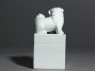 Porcelain seal surmounted by shishi, or lion dog, and pup (side)
