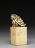 Soapstone seal surmounted by six-legged toad (side)