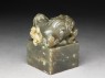 Jade seal surmounted by lion-dog with four pups and ball (oblique)