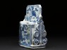 Blue-and-white brush stand with three figures (side)