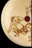 Manjū netsuke depicting a boy throwing beans at the Setsubun festival (detail)
