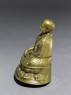 Seated figure of a lama (oblique)