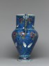Jug with flowers against a fish-scale background (side)