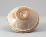 White ware bowl with rocks emerging from waves (oblique)