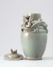 Greenware funerary jar and lid with dragon, bird, and a dog (oblique)